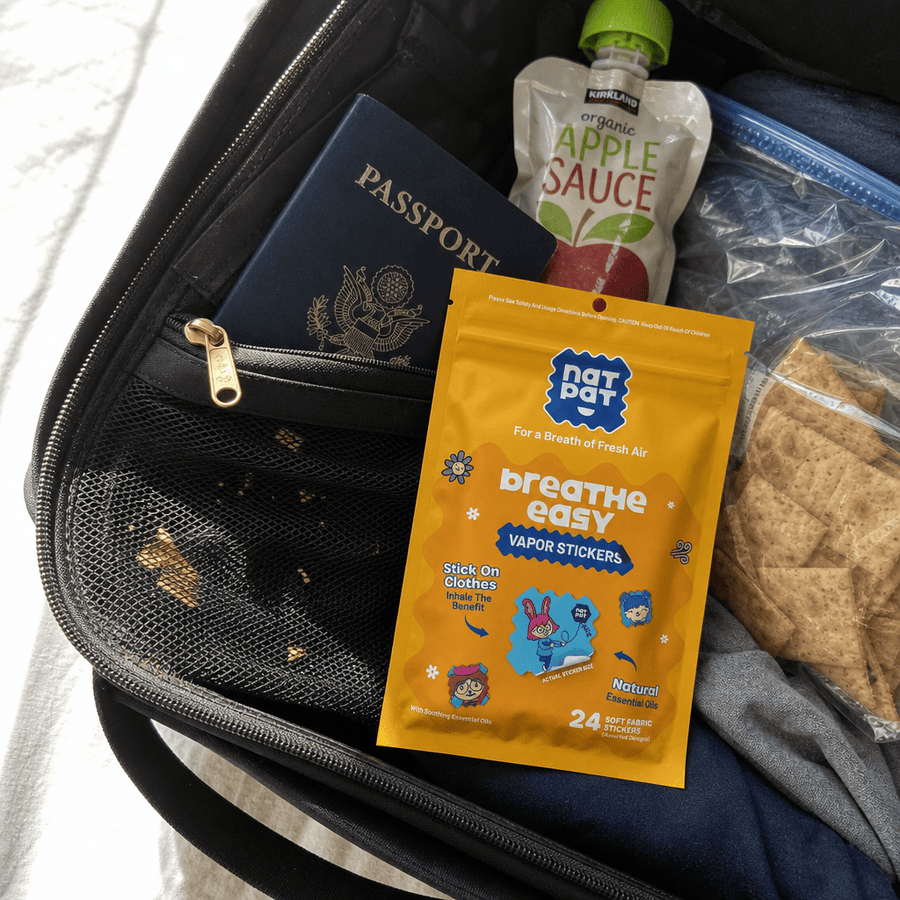 A parent packing a StuffyPatch sticker alongside travel essentials for a trip with their child.