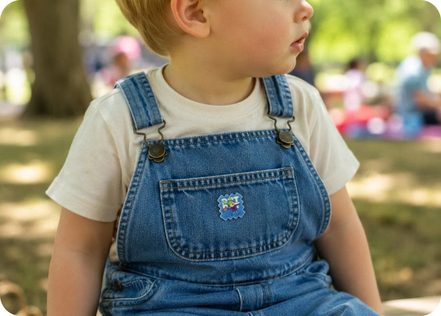 A child outdoors wearing BuzzPatch stickers on their clothing, ready to play.