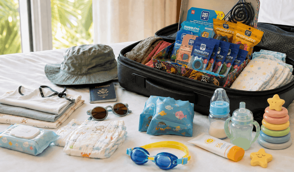 Open NatPat travel tin packed inside a carry-on suitcase