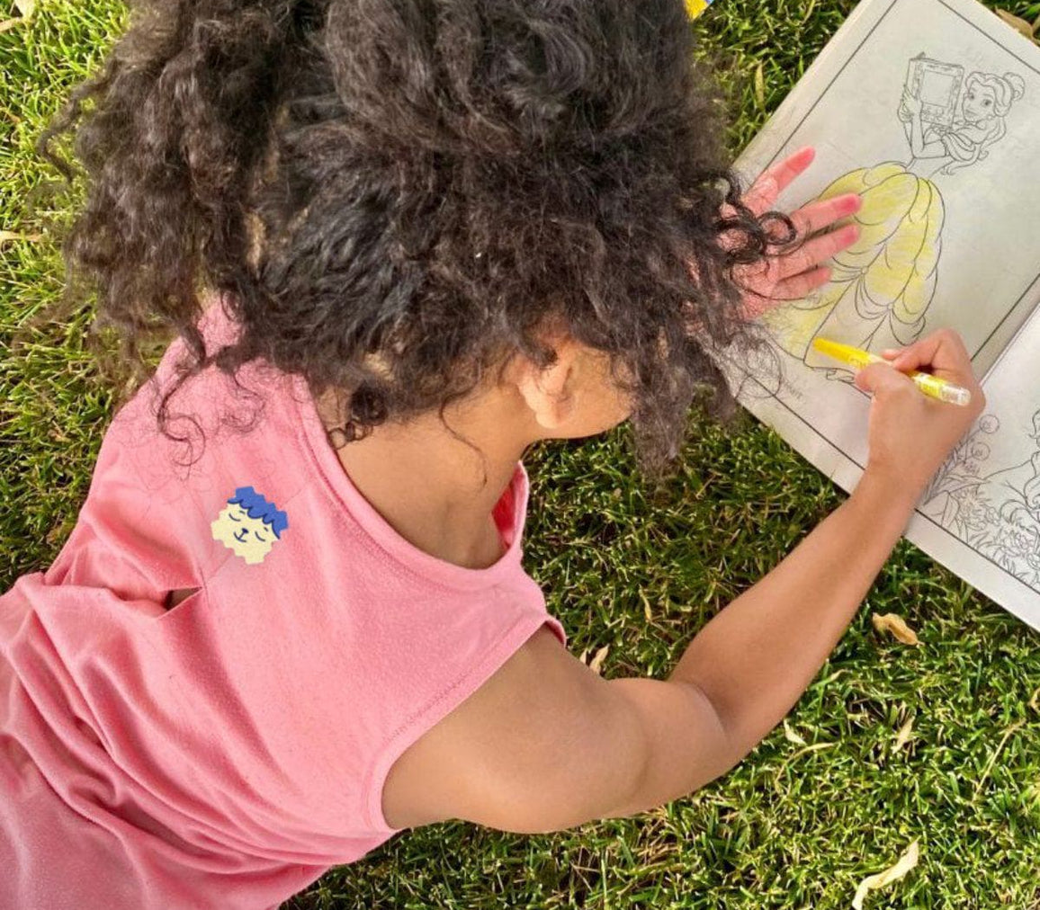Child playing outside wearing a ZenPatch sticker