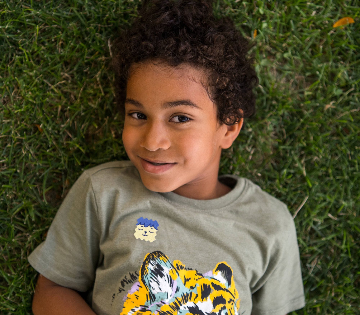 Child playing outside wearing a ZenPatch sticker