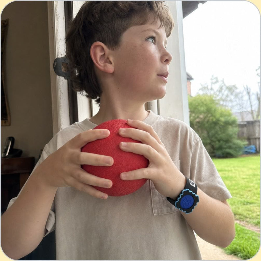 A child wearing the NATPAT mosquito repellent Slap Band outdoors.