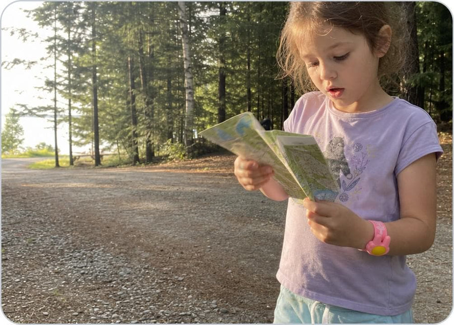 A parent loads the citronella pellet into the Slap Band before a child heads outside.