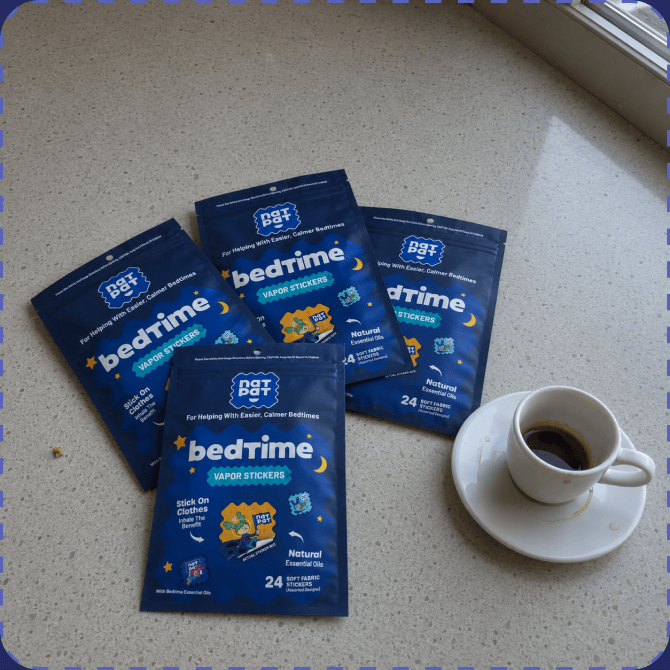 Four navy NATPAT bedtime Vapor Stickers pouches fanned out on a pale speckled windowsill beside a white cup of espresso on a saucer.